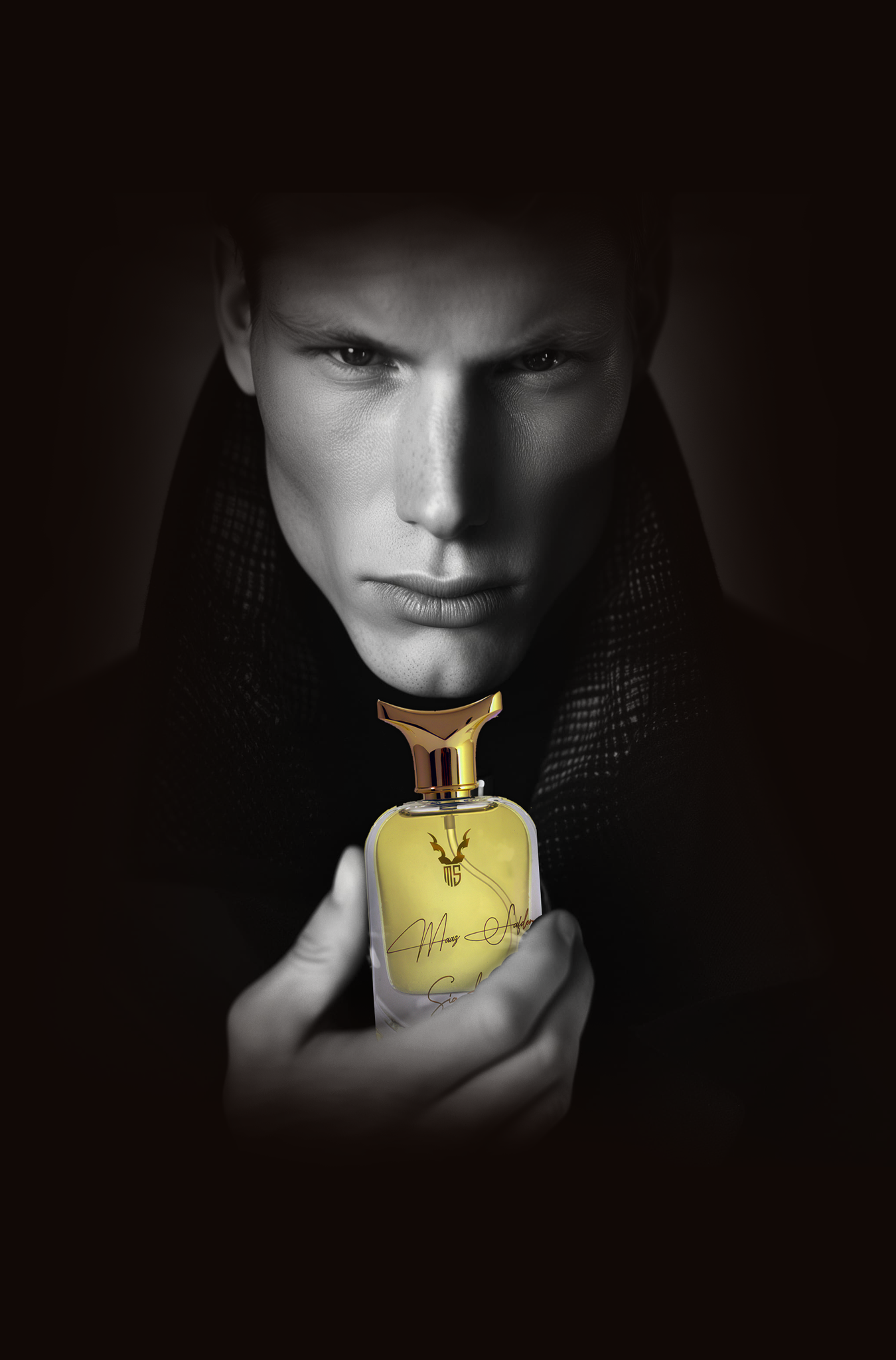 Man holding a gold perfume bottle against a dark background